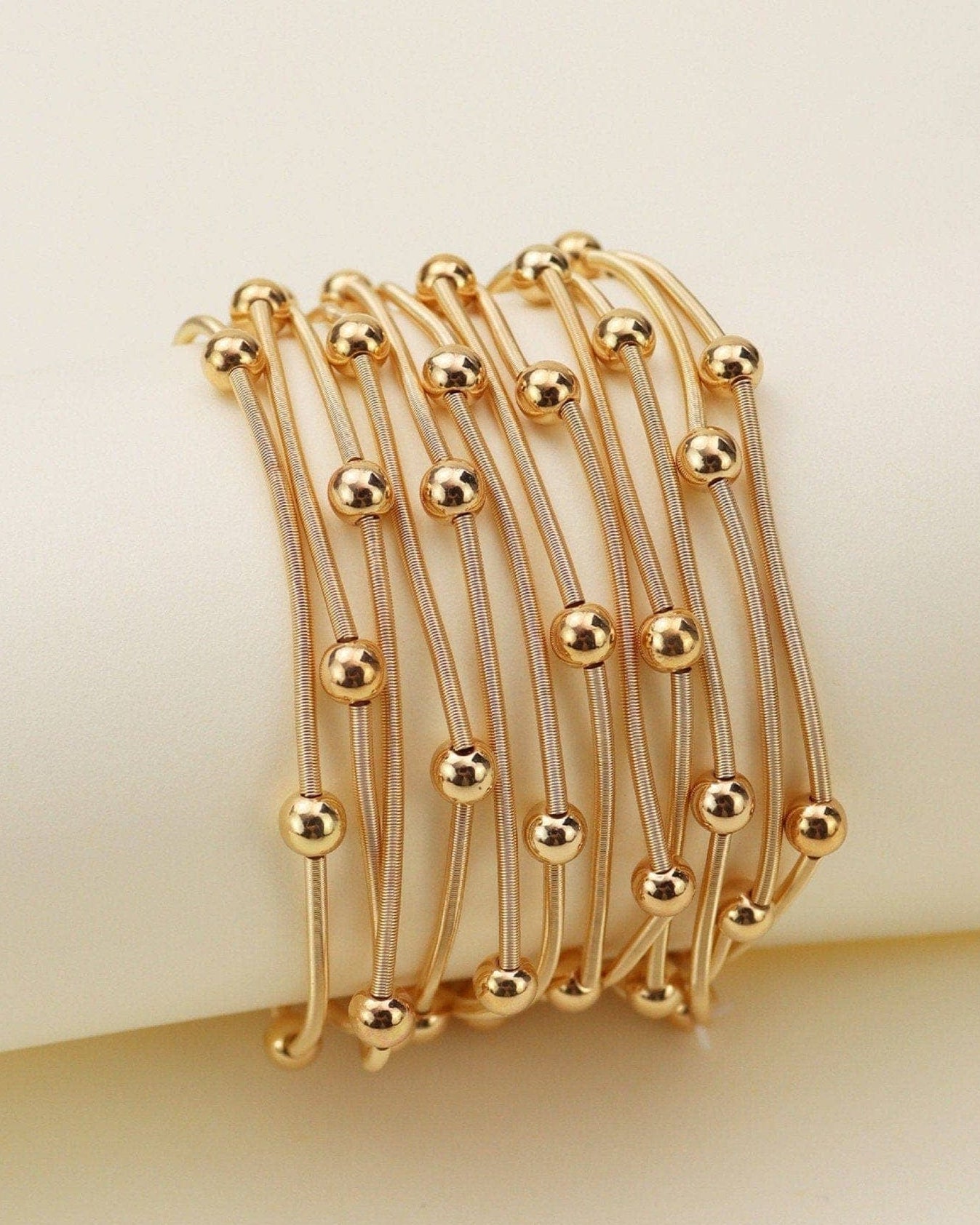 Gold Metallic Beads Multi Strand Bracelet